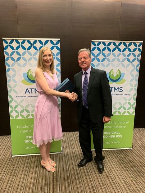 Angie Savva receiving the Practitioner of the Year Award at the 2019 ATMS Natural Medicine Awards